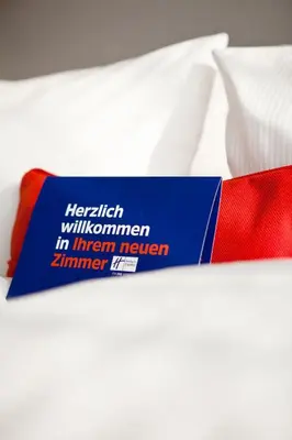 Ein Bett oder Betten in einem Zimmer der Unterkunft Holiday Inn Express Munich - Olympiapark by IHG