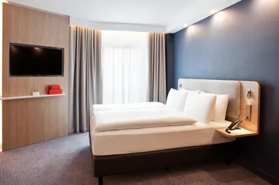 Ein Bett oder Betten in einem Zimmer der Unterkunft Holiday Inn Express Munich - Olympiapark by IHG