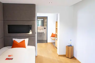 Ein Bett oder Betten in einem Zimmer der Unterkunft Hotel Alpenblick
