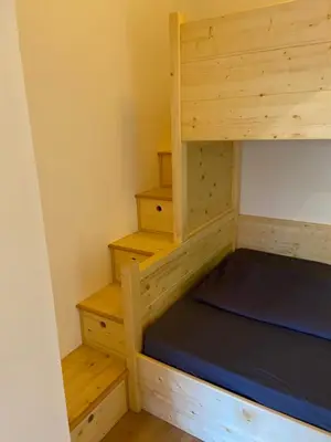 Ein Bett oder Betten in einem Zimmer der Unterkunft Puppi' s Nest mit Alpspitzblick in Garmisch- Partenkirchen