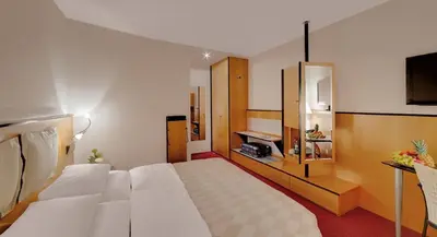 Ein Bett oder Betten in einem Zimmer der Unterkunft Hotel am Rathaus