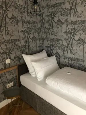 Ein Bett oder Betten in einem Zimmer der Unterkunft Bayerischer Hof