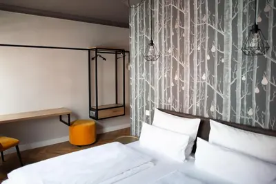 Ein Bett oder Betten in einem Zimmer der Unterkunft Bayerischer Hof
