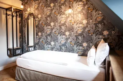 Ein Bett oder Betten in einem Zimmer der Unterkunft Bayerischer Hof