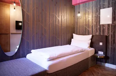 Ein Bett oder Betten in einem Zimmer der Unterkunft Bayerischer Hof