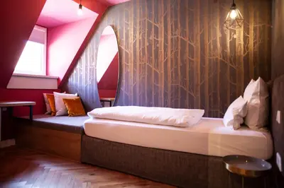 Ein Bett oder Betten in einem Zimmer der Unterkunft Bayerischer Hof