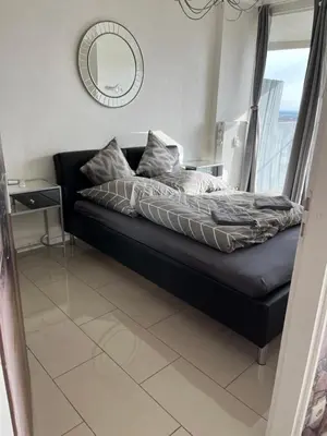 Ein Sitzbereich in der Unterkunft SUITE-XXI City View Hotelturm Augsburg