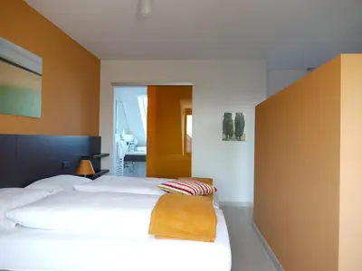 Ein Bett oder Betten in einem Zimmer der Unterkunft KH Hotel