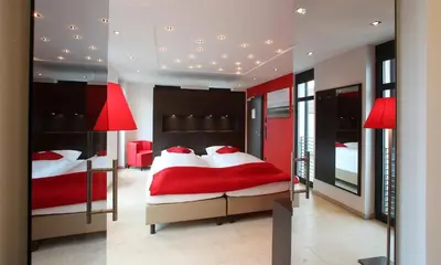 Ein Bett oder Betten in einem Zimmer der Unterkunft KH Hotel