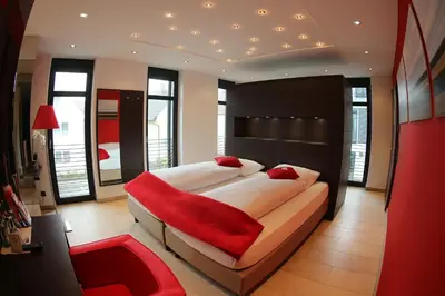 Ein Bett oder Betten in einem Zimmer der Unterkunft KH Hotel