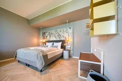 Ein Bett oder Betten in einem Zimmer der Unterkunft Vienna House Easy by Wyndham Augsburg