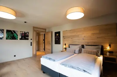 Ein Bett oder Betten in einem Zimmer der Unterkunft BergLoft 360 mit Sauna und Fitness