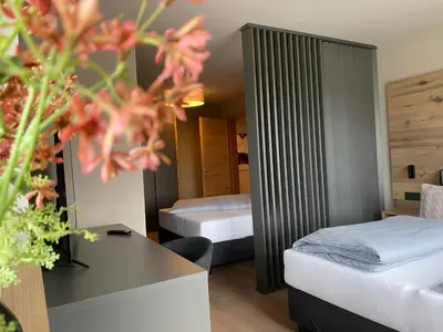 Ein Bett oder Betten in einem Zimmer der Unterkunft BergLoft 360 mit Sauna und Fitness