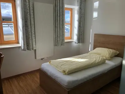 Ein Bett oder Betten in einem Zimmer der Unterkunft Fischerhof