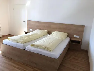 Ein Bett oder Betten in einem Zimmer der Unterkunft Fischerhof