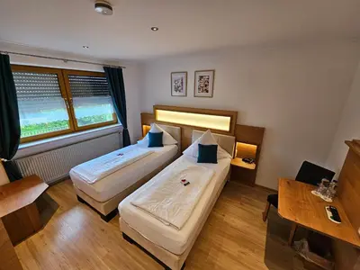 Ein Bett oder Betten in einem Zimmer der Unterkunft Land-gut-Hotel Gasthof Waldschänke