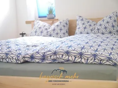 Ein Bett oder Betten in einem Zimmer der Unterkunft Ihre Ferienwohnung bayrisch mehr...