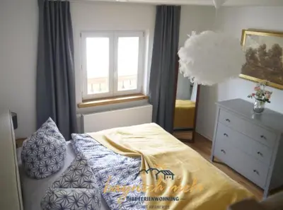 Ein Bett oder Betten in einem Zimmer der Unterkunft Ihre Ferienwohnung bayrisch mehr...