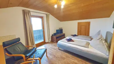 Ein Bett oder Betten in einem Zimmer der Unterkunft Chiemsee-Ferienhaus Schlegel