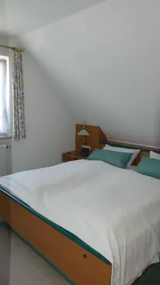 Ein Bett oder Betten in einem Zimmer der Unterkunft Ferienwohnung Mittl
