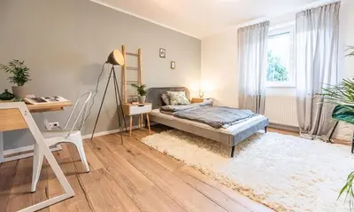 Ein Bett oder Betten in einem Zimmer der Unterkunft Arbio I Cozy Apartment Augsburg-Göggingen