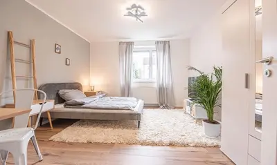 Ein Bett oder Betten in einem Zimmer der Unterkunft Arbio I Cozy Apartment Augsburg-Göggingen
