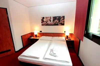 Ein Bett oder Betten in einem Zimmer der Unterkunft Ara Hotel Comfort