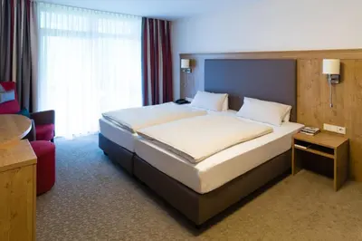 Ein Bett oder Betten in einem Zimmer der Unterkunft Hotel St. Georg