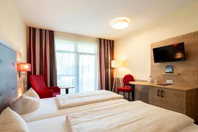 Ein Bett oder Betten in einem Zimmer der Unterkunft Hotel St. Georg