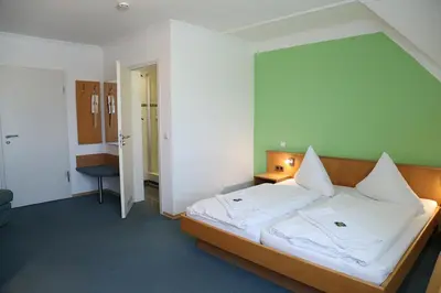 Ein Bett oder Betten in einem Zimmer der Unterkunft Zu Müllers Winkelhausen
