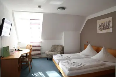 Ein Bett oder Betten in einem Zimmer der Unterkunft Zu Müllers Winkelhausen