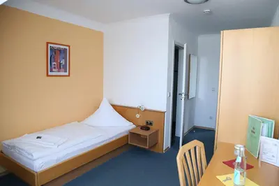 Ein Bett oder Betten in einem Zimmer der Unterkunft Zu Müllers Winkelhausen