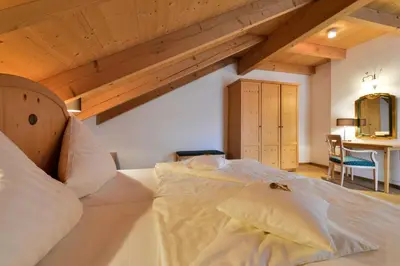 Ein Bett oder Betten in einem Zimmer der Unterkunft Landhotel Huber am See