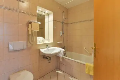 Ein Badezimmer in der Unterkunft Landhotel Huber am See