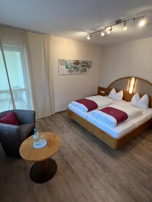 Ein Bett oder Betten in einem Zimmer der Unterkunft Hotel garni St.Georg