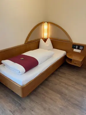 Ein Bett oder Betten in einem Zimmer der Unterkunft Hotel garni St.Georg