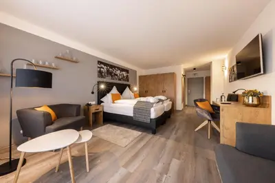 Ein Bett oder Betten in einem Zimmer der Unterkunft Hotel Tanneck