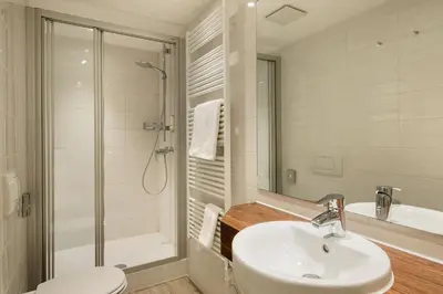 Ein Badezimmer in der Unterkunft Posthotel Kolberbräu