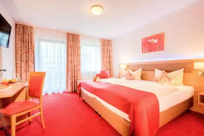 Ein Bett oder Betten in einem Zimmer der Unterkunft Ströbinger Hof - Therme Wellness Resort