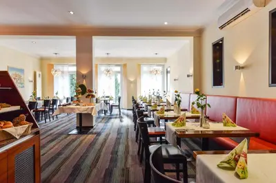 Ein Sitzbereich in der Unterkunft Bavaria Hotel