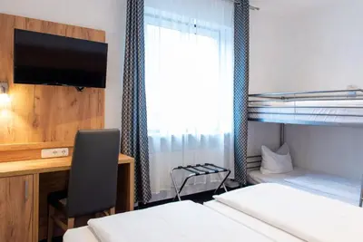 Ein Bett oder Betten in einem Zimmer der Unterkunft Hotel Fischertor