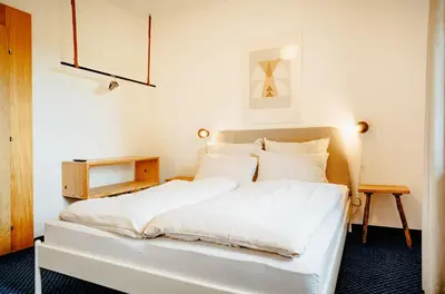 Ein Bett oder Betten in einem Zimmer der Unterkunft Alpenrose Bayrischzell Hotel