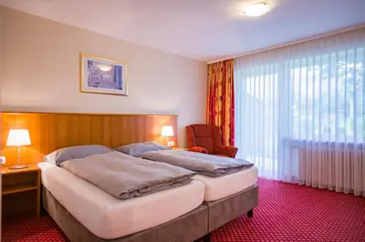 Ein Bett oder Betten in einem Zimmer der Unterkunft Hotel Friedenseiche