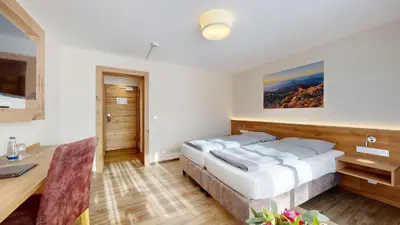 Ein Bett oder Betten in einem Zimmer der Unterkunft Hotel Friedenseiche