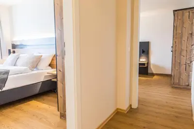 Ein Bett oder Betten in einem Zimmer der Unterkunft Chiemseer Wirtshaus