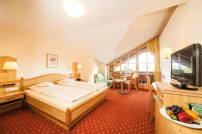 Ein Bett oder Betten in einem Zimmer der Unterkunft SeeHotel Wassermann