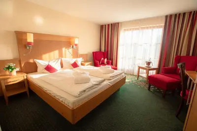 Ein Bett oder Betten in einem Zimmer der Unterkunft SeeHotel Wassermann