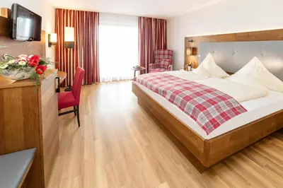 Ein Bett oder Betten in einem Zimmer der Unterkunft SeeHotel Wassermann