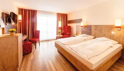 Ein Bett oder Betten in einem Zimmer der Unterkunft SeeHotel Wassermann