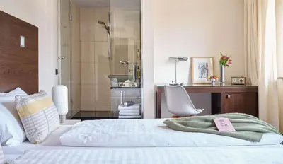 Ein Bett oder Betten in einem Zimmer der Unterkunft Flemings Hotel München-Schwabing